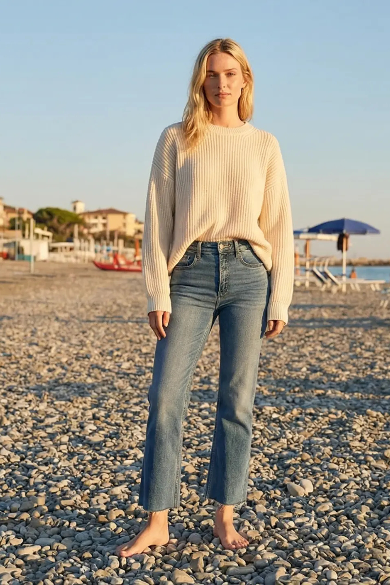 Woman wearing medium wash high rise straight leg jeans with single cuffed hem and tummy control, Rosie Karma boutique