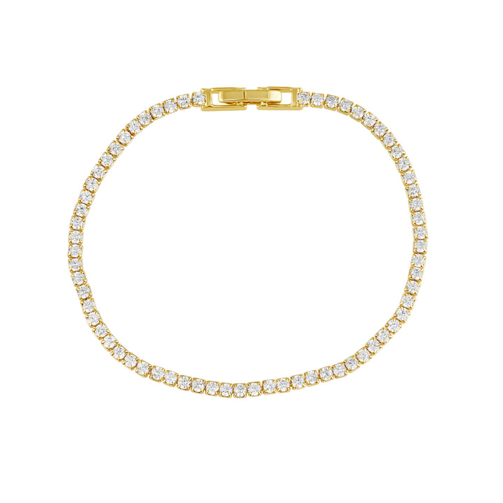 Gold bracelet with clear stones on a white background