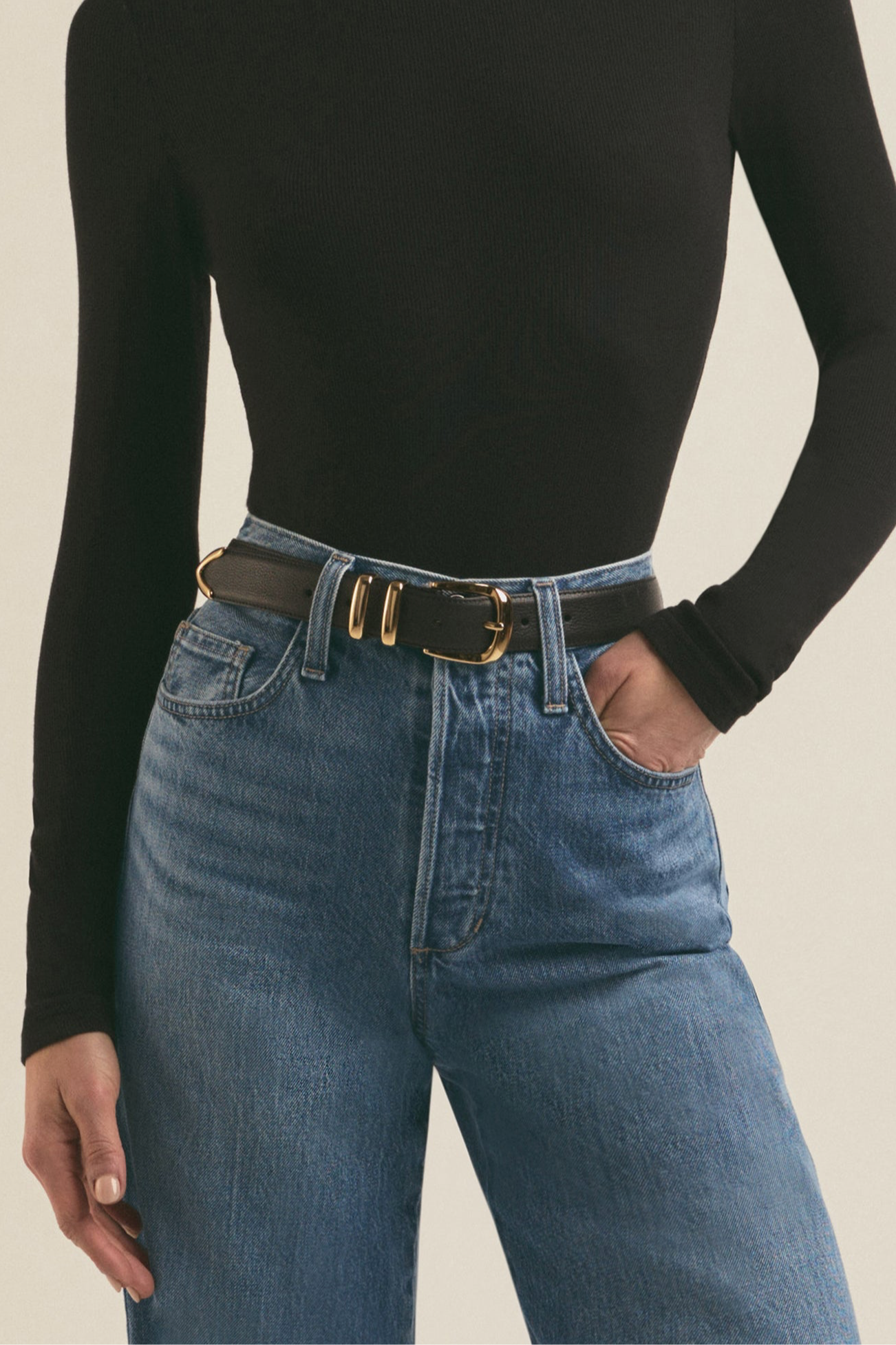 Black Jordan leather belt with polished hardware and feather-edge detailing – adjustable women’s belt for waist or hip styling