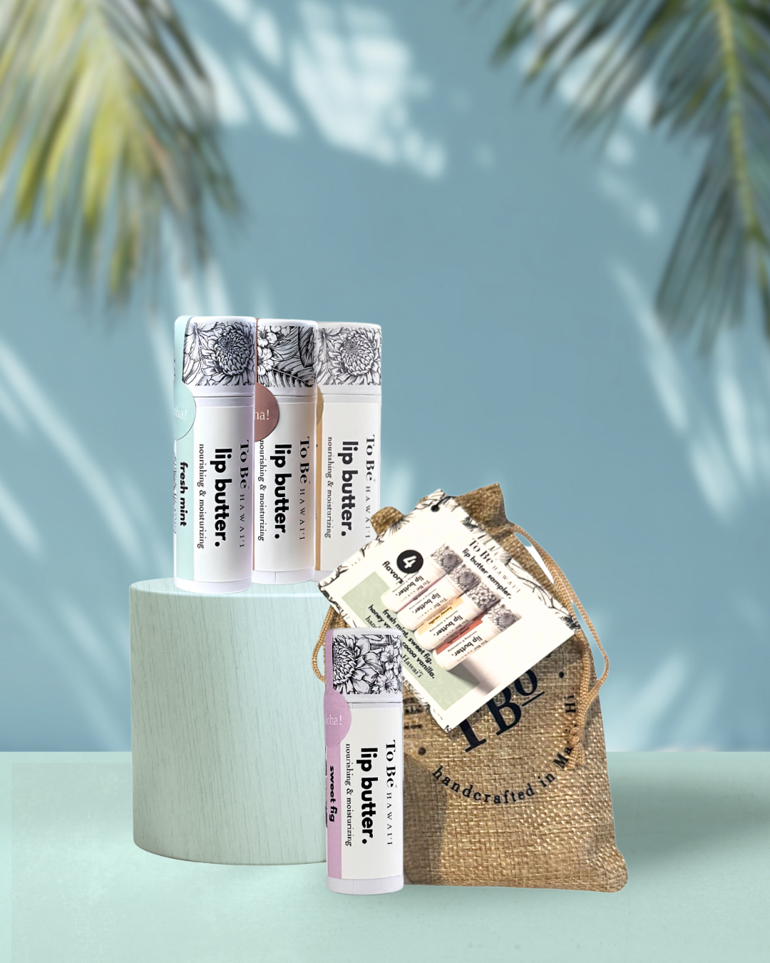 Lip butter bundle with a small muslin bag on a light blue background