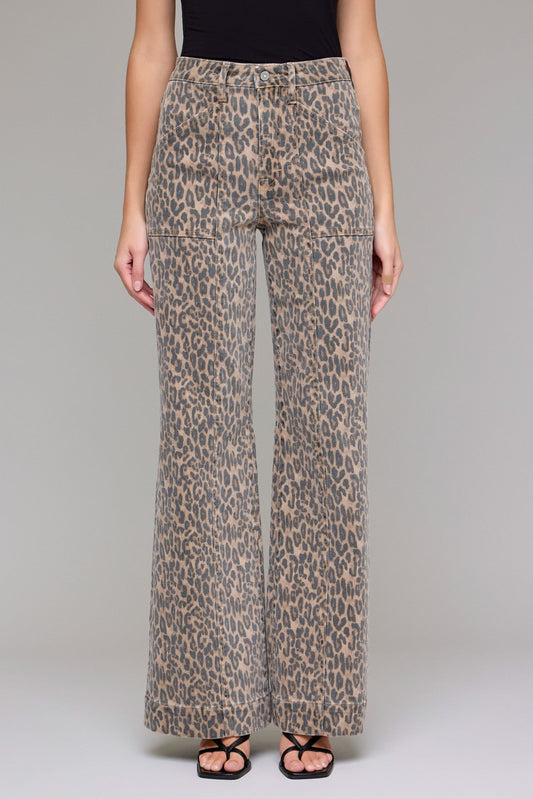Leopard print pants worn by a person on a plain background
