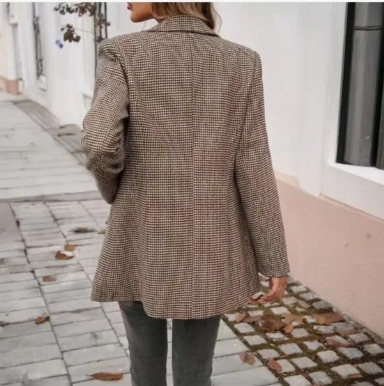 Women wearing lapel buttoned blazer and white v neck and jeans