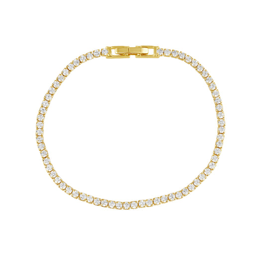 Gold bracelet with clear stones on a white background
