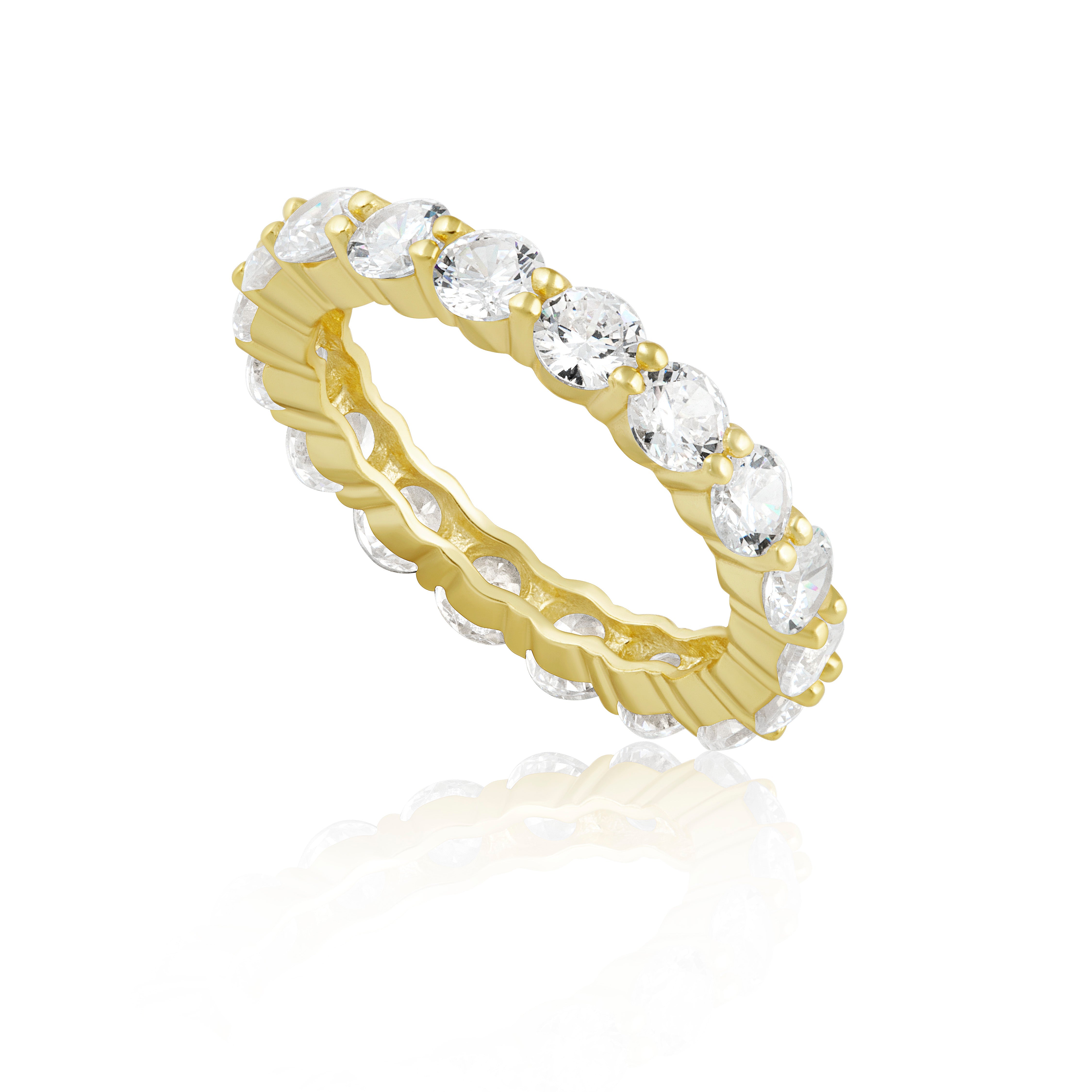 Gold ring with cz stones on a white background