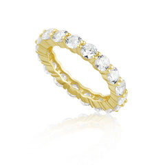 Gold ring with cz stones on a white background