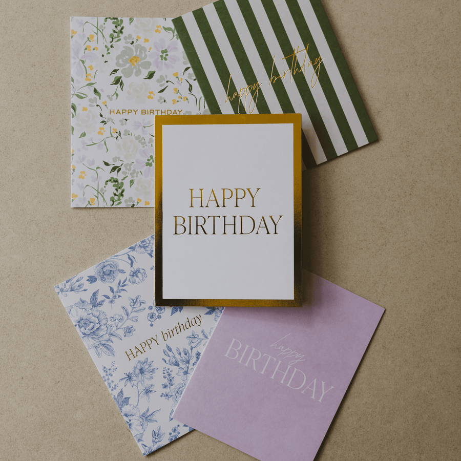 Collection of birthday cards with different designs on a brown background