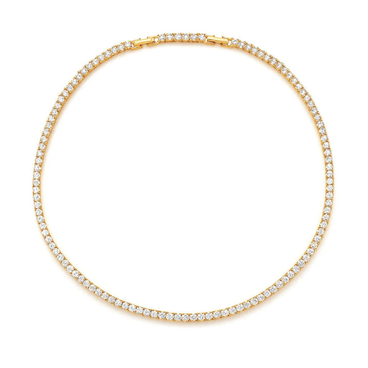 Gold necklace with clear stones on a white background