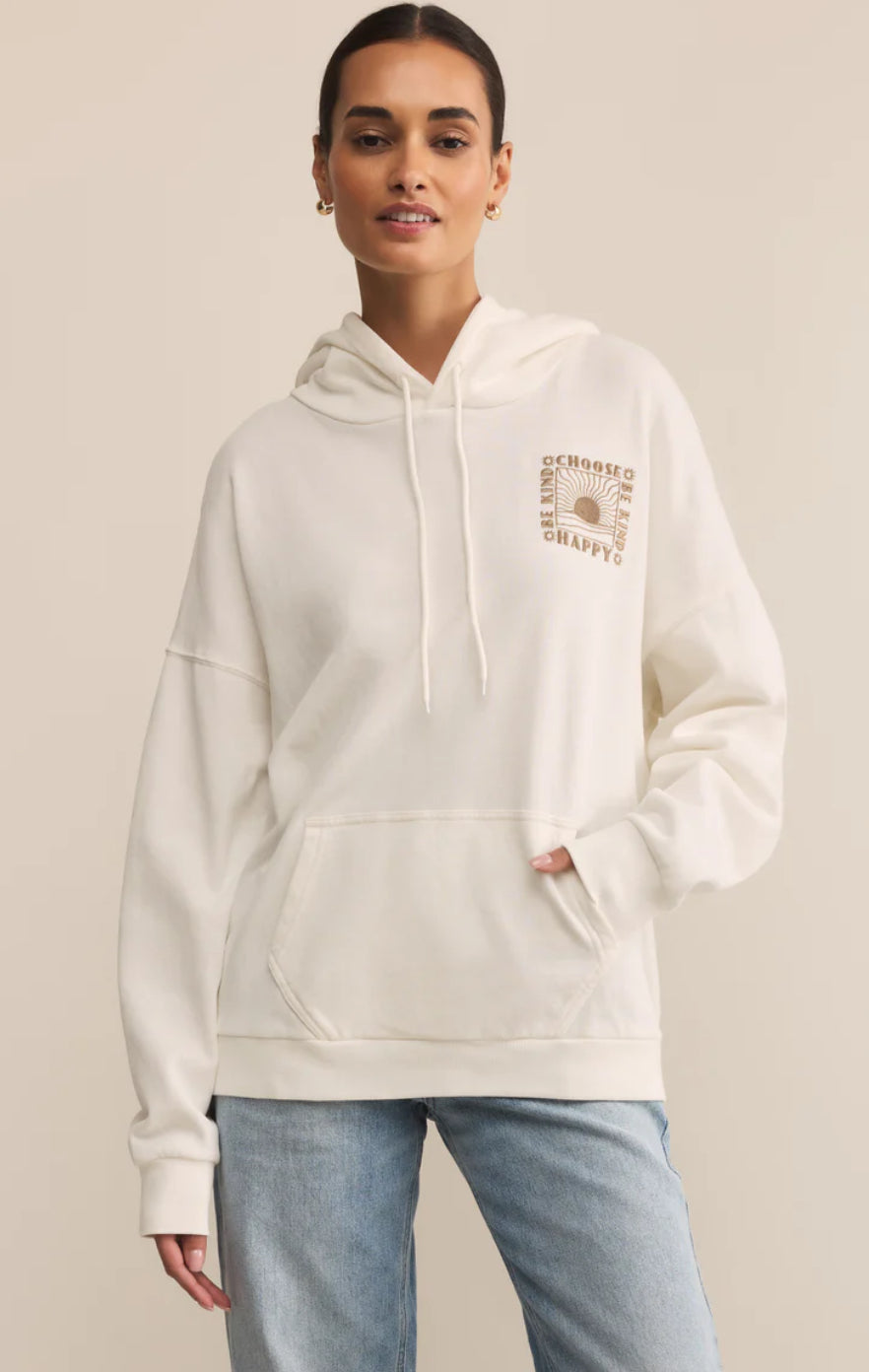 women in an off white sweatshirt with embroidery