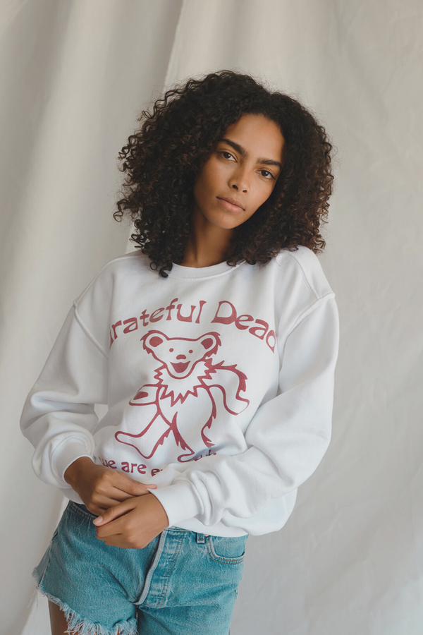 People of Leisure Grateful Dead Everywhere Sweatshirt — white 100% cotton crewneck with the “We Are Everywhere” graphic.
