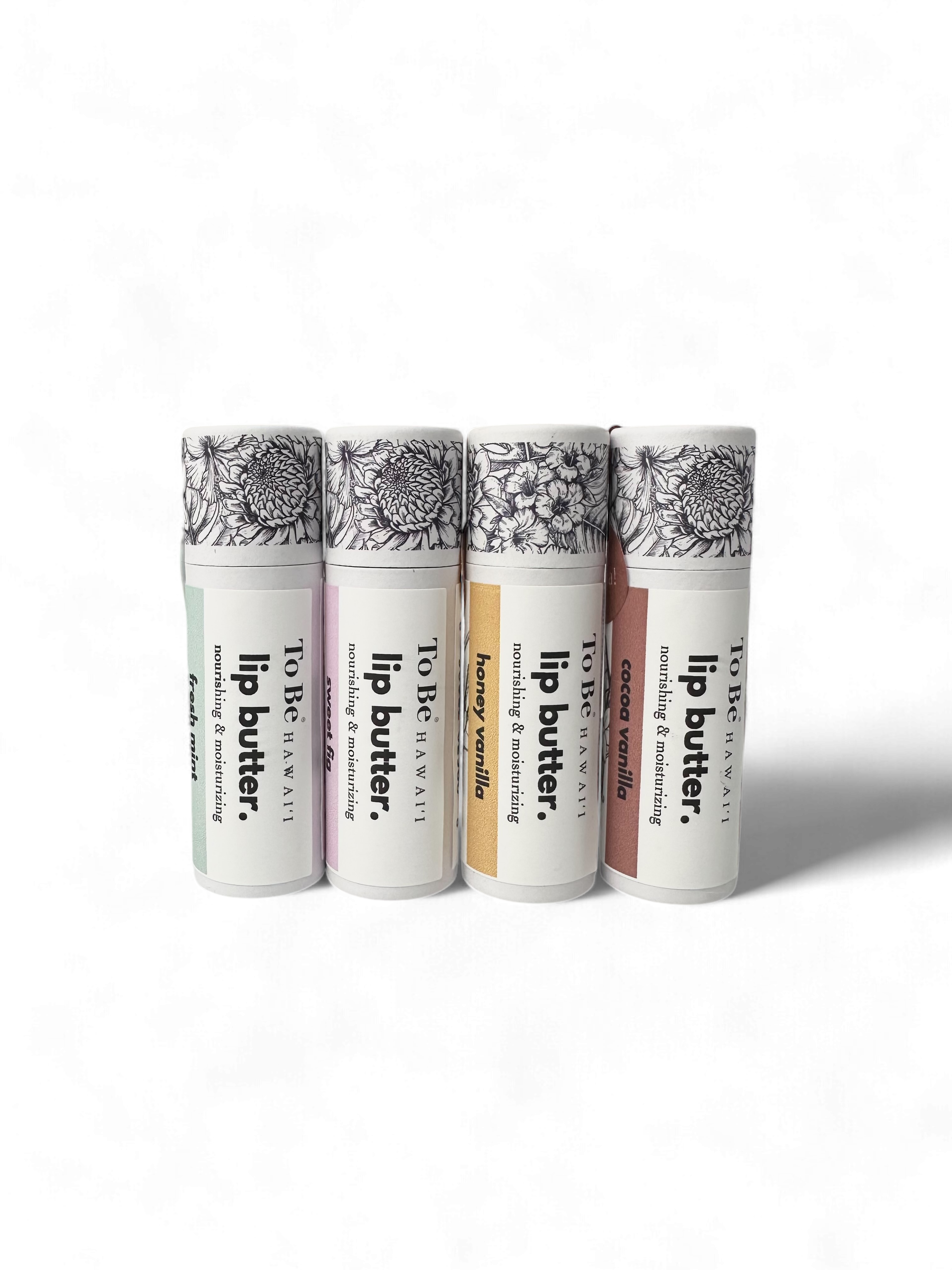 Four lip butter tubes with decorative labels on a white background - organic, vegan, cruelty free