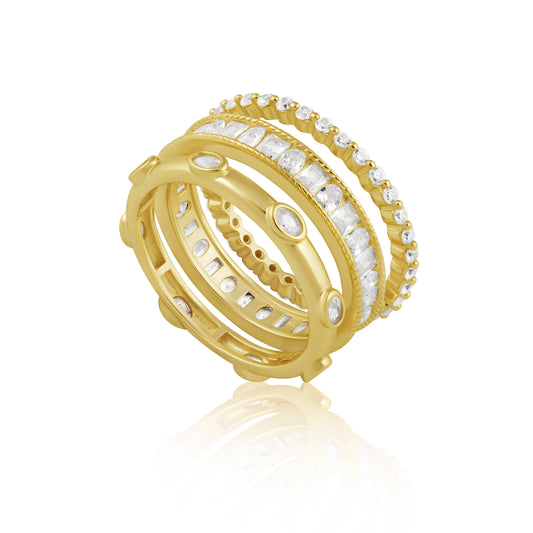 Gold ring with embedded diamonds on a white background