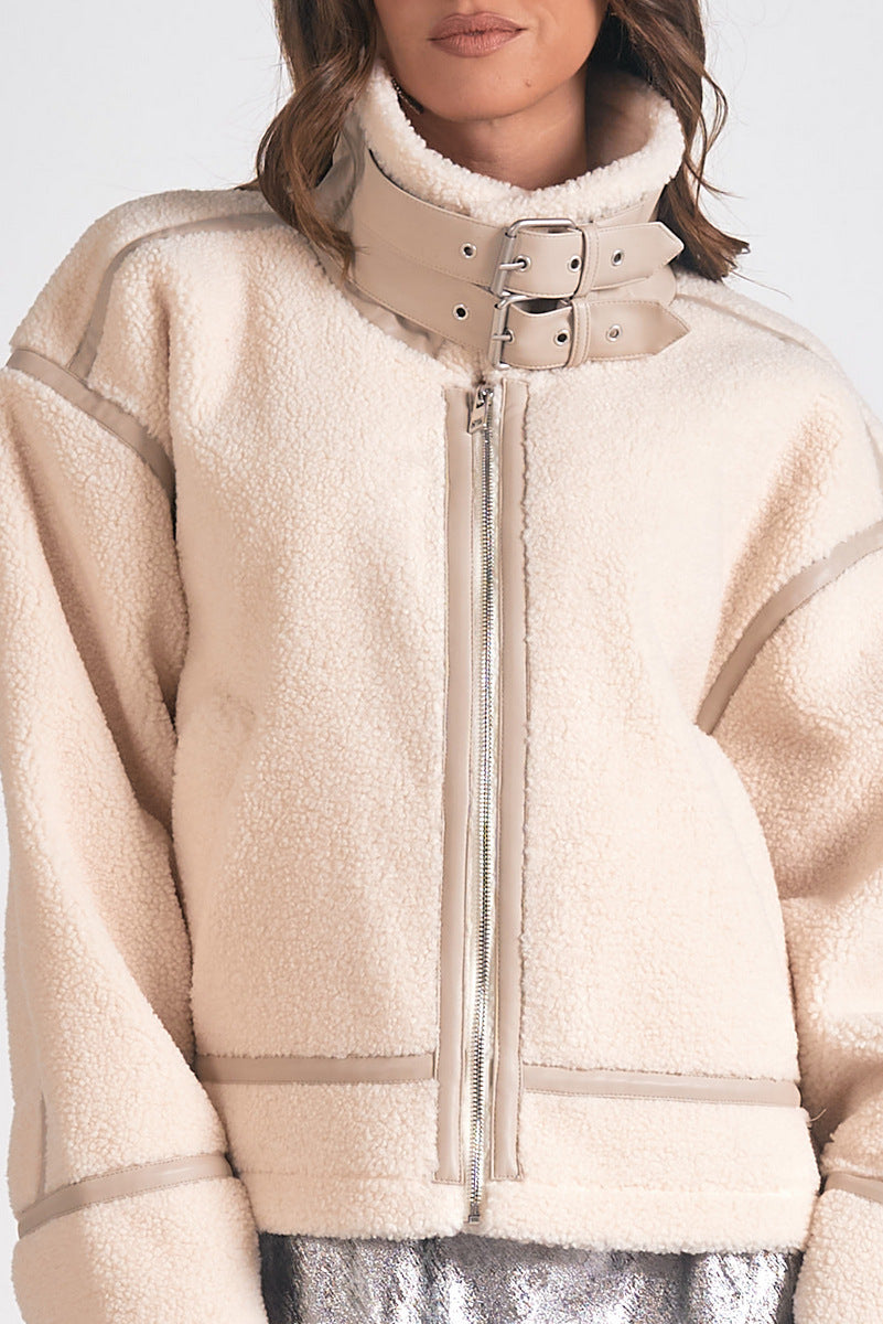 Beige fleece jacket with a zipper on a white background