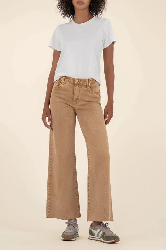Person wearing a white t-shirt and Meg tan high-rise wide-leg jeans on a beige background