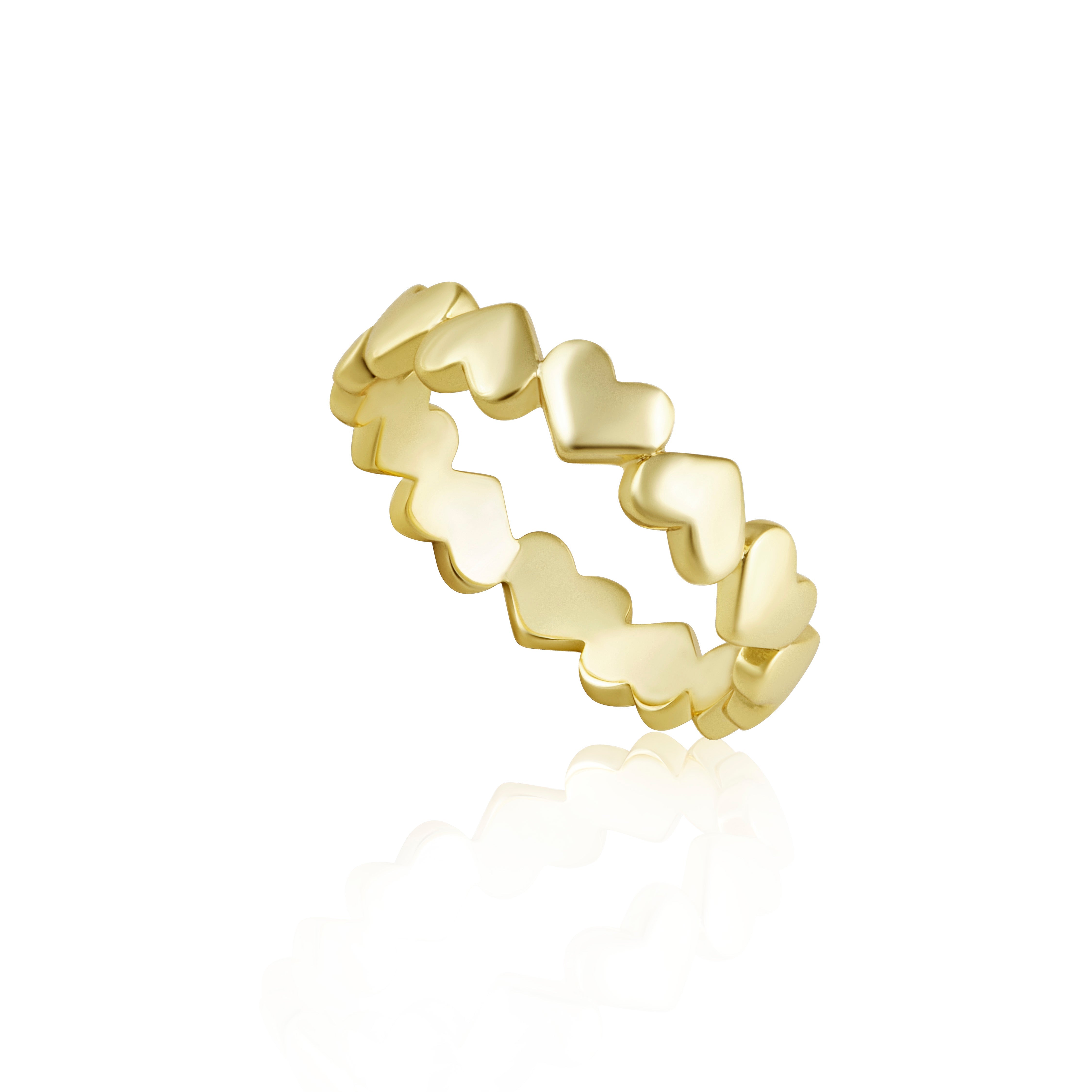Gold ring with heart-shaped design on a white background