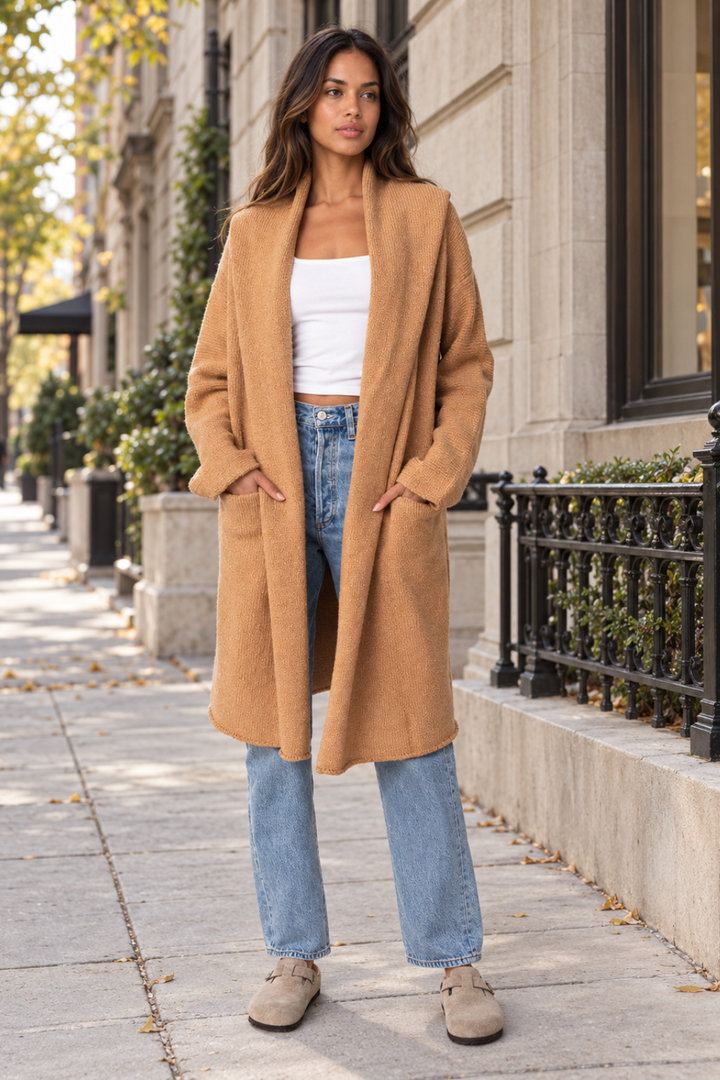 A woman wearing the Lovestitch Lennox Sweater Coat in Camel being sold at Rosie Karma