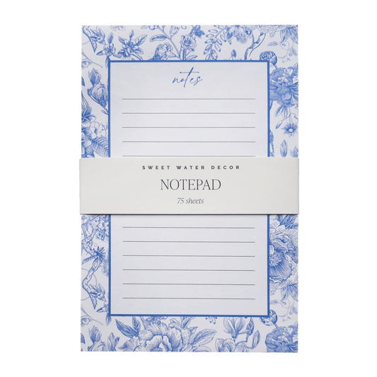 Notepad with blue floral design on a white background