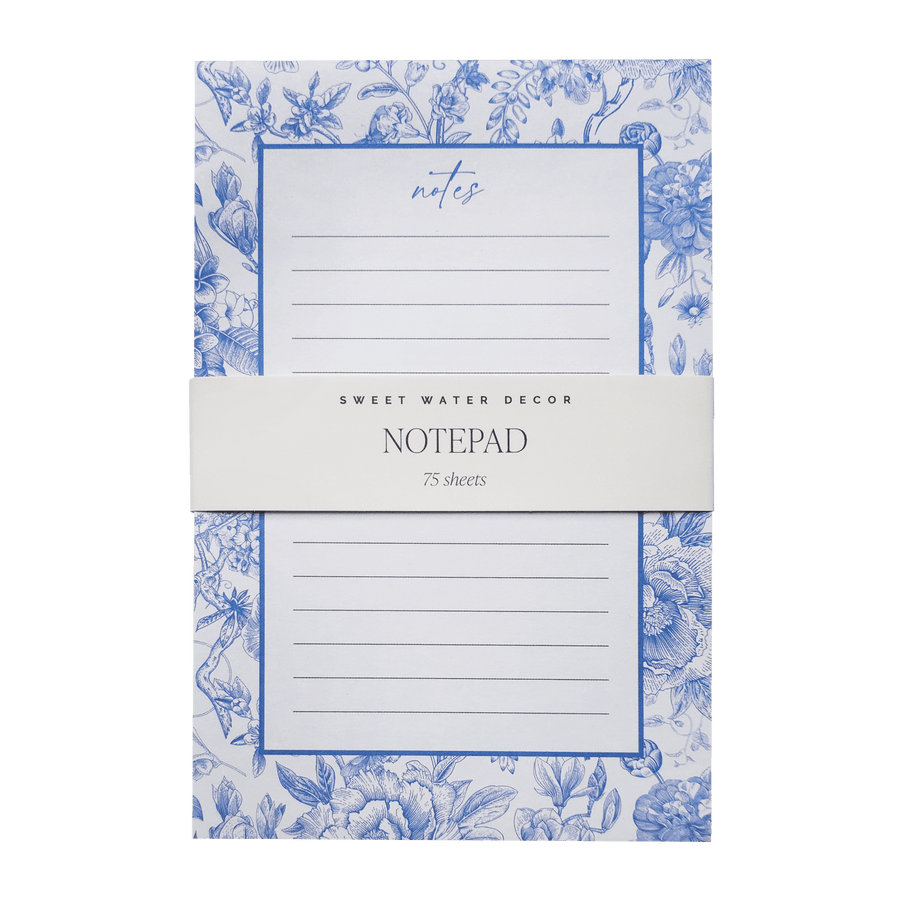 Notepad with blue floral design on a white background