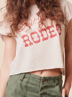“But First, Rodeo” Crop Top in ecru — western graphic crop top with raw-edge sleeves in organic cotton.