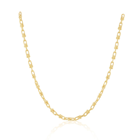 Gold chain necklace on a white background