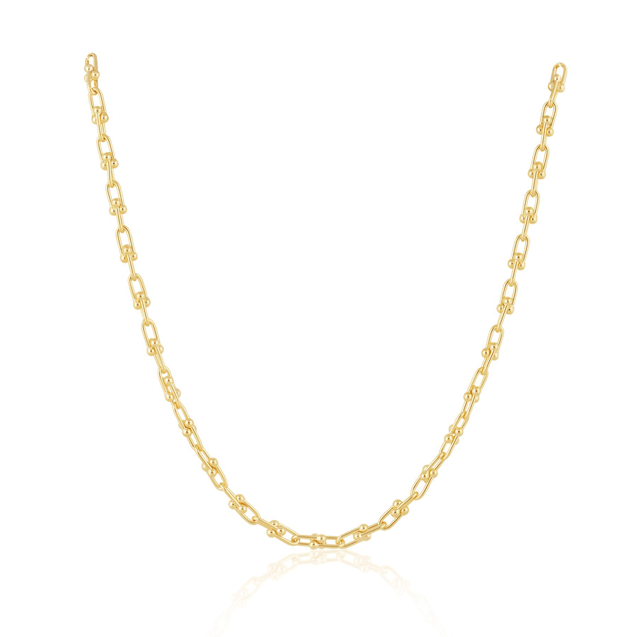 Gold chain necklace on a white background