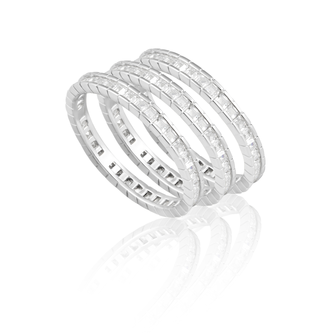 Stack of silver rings on a white background