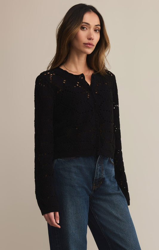 Woman wearing black lightweight relaxed fit crochet cardigan for easy layering