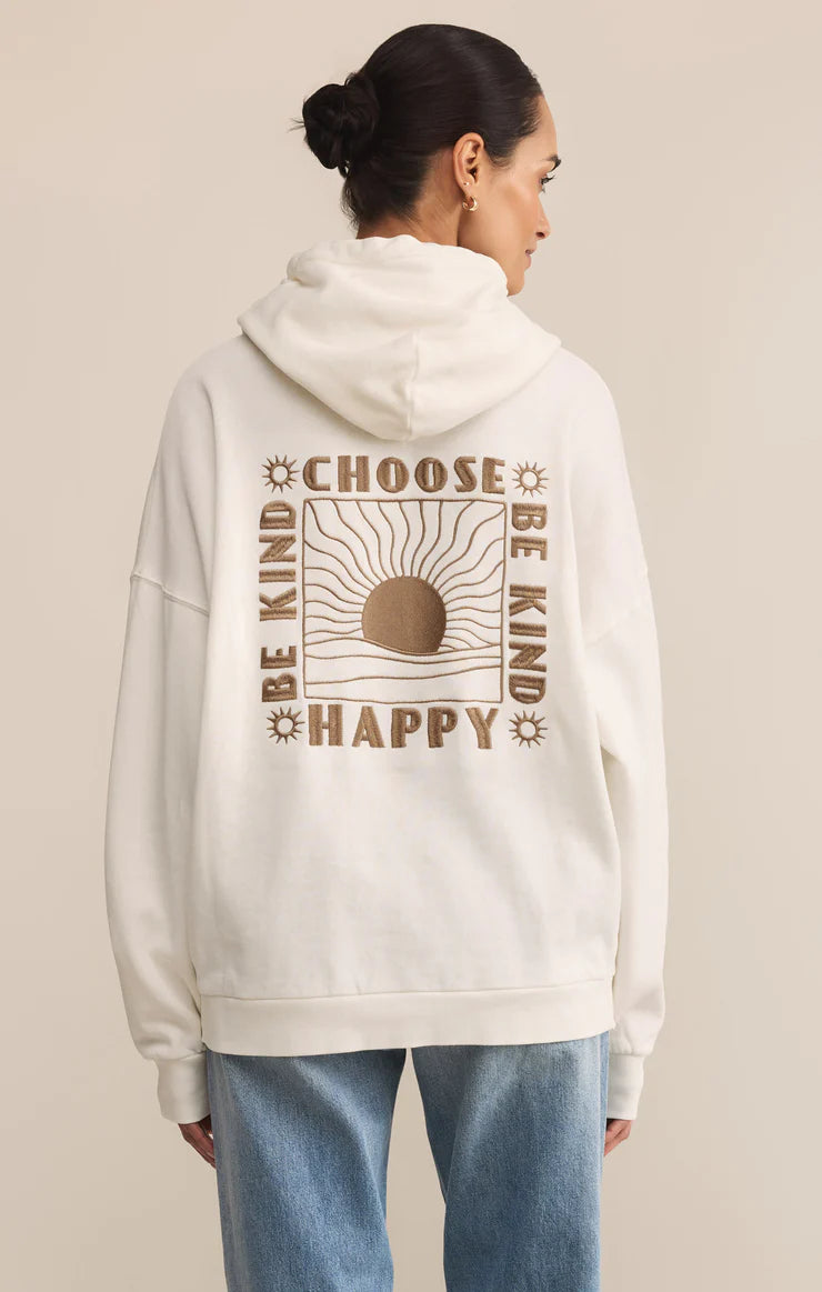 women in an off white sweatshirt with embroidery