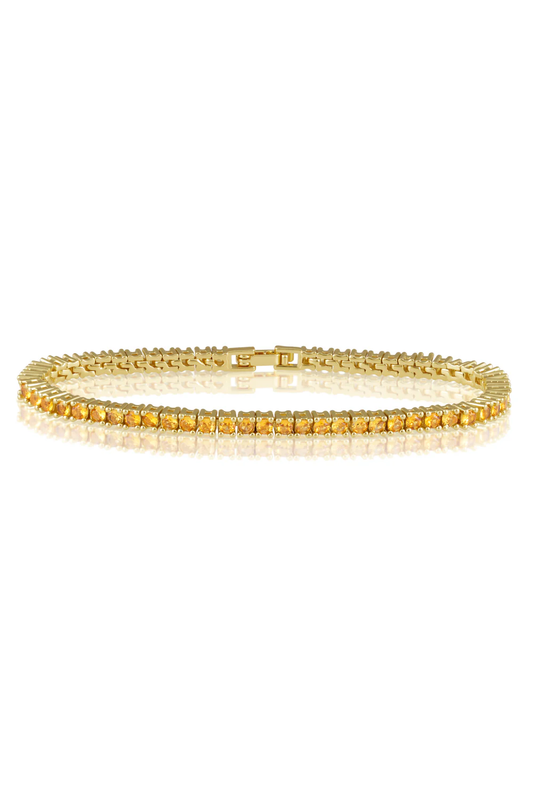 Gold bracelet on a white background