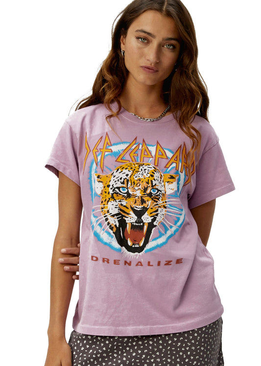 Model wearing a pink Def Leppard t-shirt with a graphic design of a tiger and text.