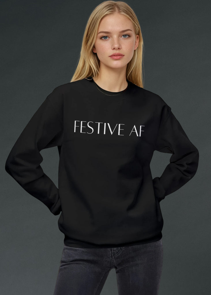 Person wearing a black sweatshirt with 'FESTIVE AF' text on a dark background