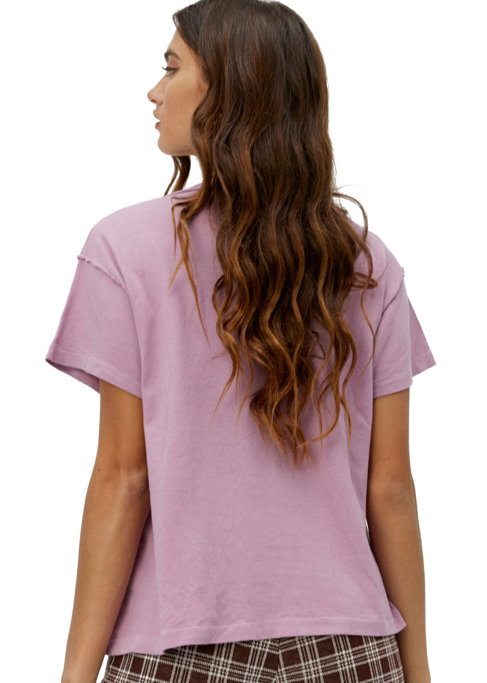 Woman wearing a light purple t-shirt on a white background