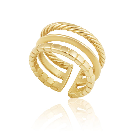 Gold ring with a twisted design on a white background