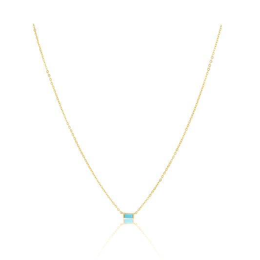 Gold necklace with a blue gemstone on a white background