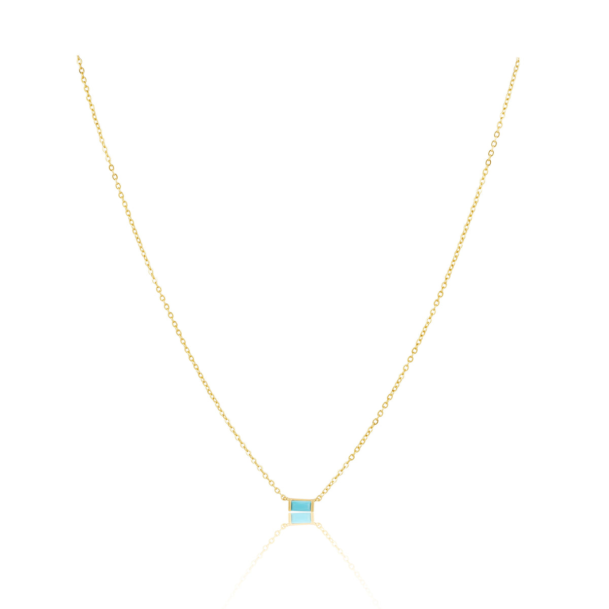 Gold necklace with a blue gemstone on a white background