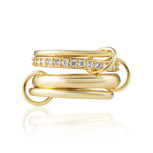 Gold ring with diamond accents on a white background