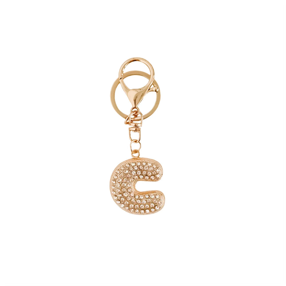Gold keychain with letter 'C' on a white background