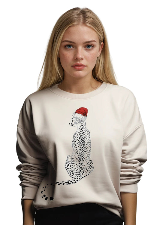Woman wearing a beige sweater with a cheetah graphic and red Santa hat on a white background