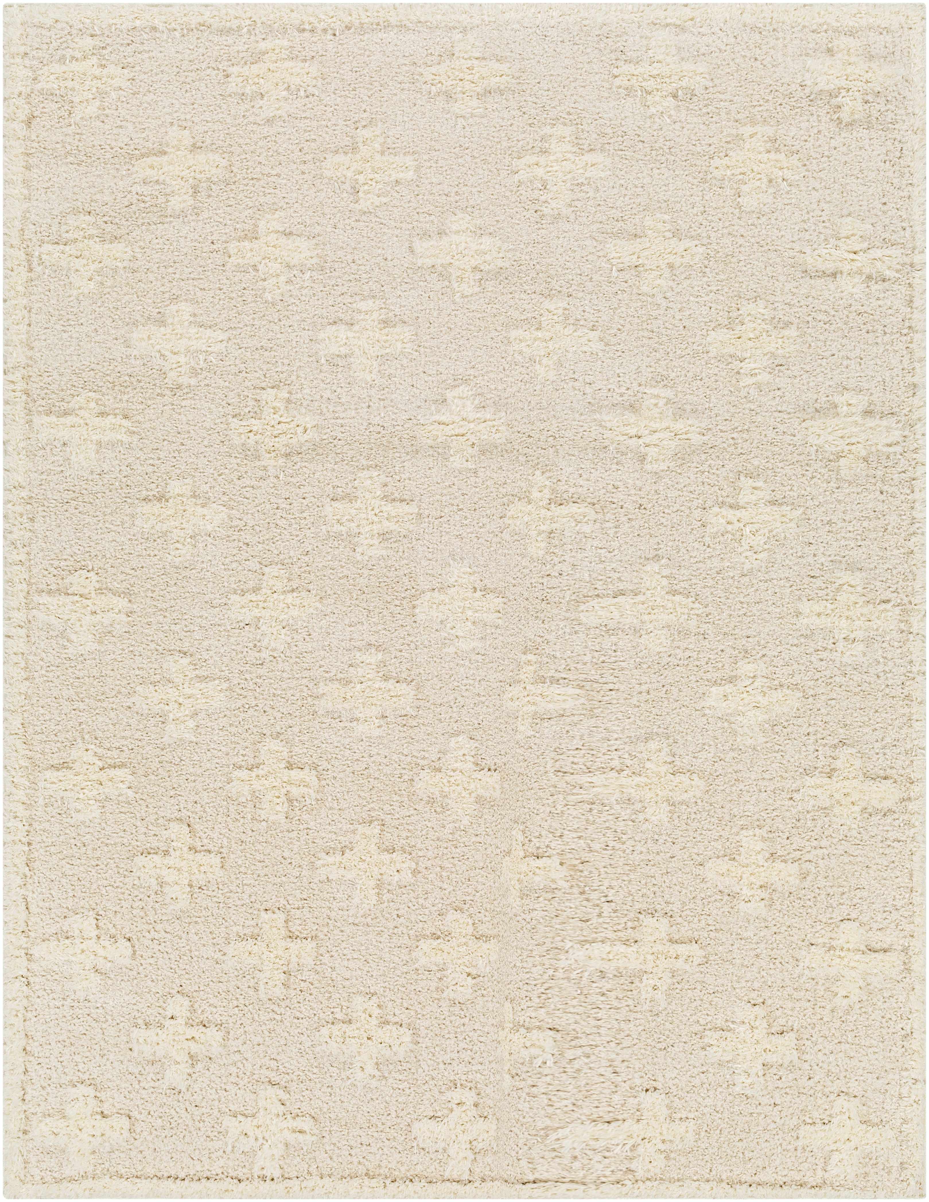 Close-up of a textured beige rug on a wooden floor