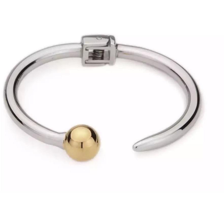 Silver cuff bracelet with gold ball end