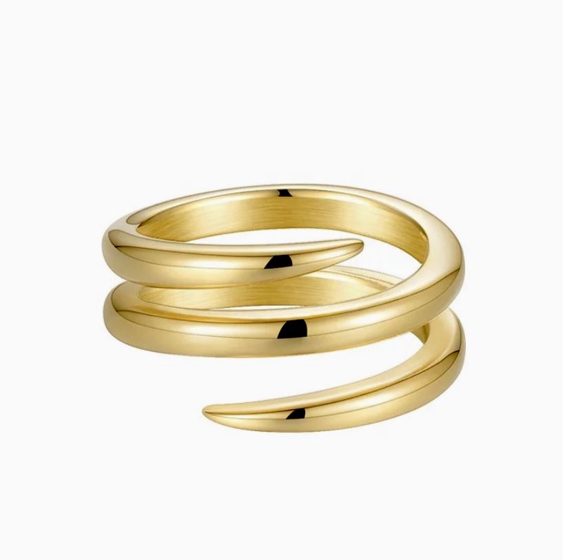 Gold spiral ring on a white background