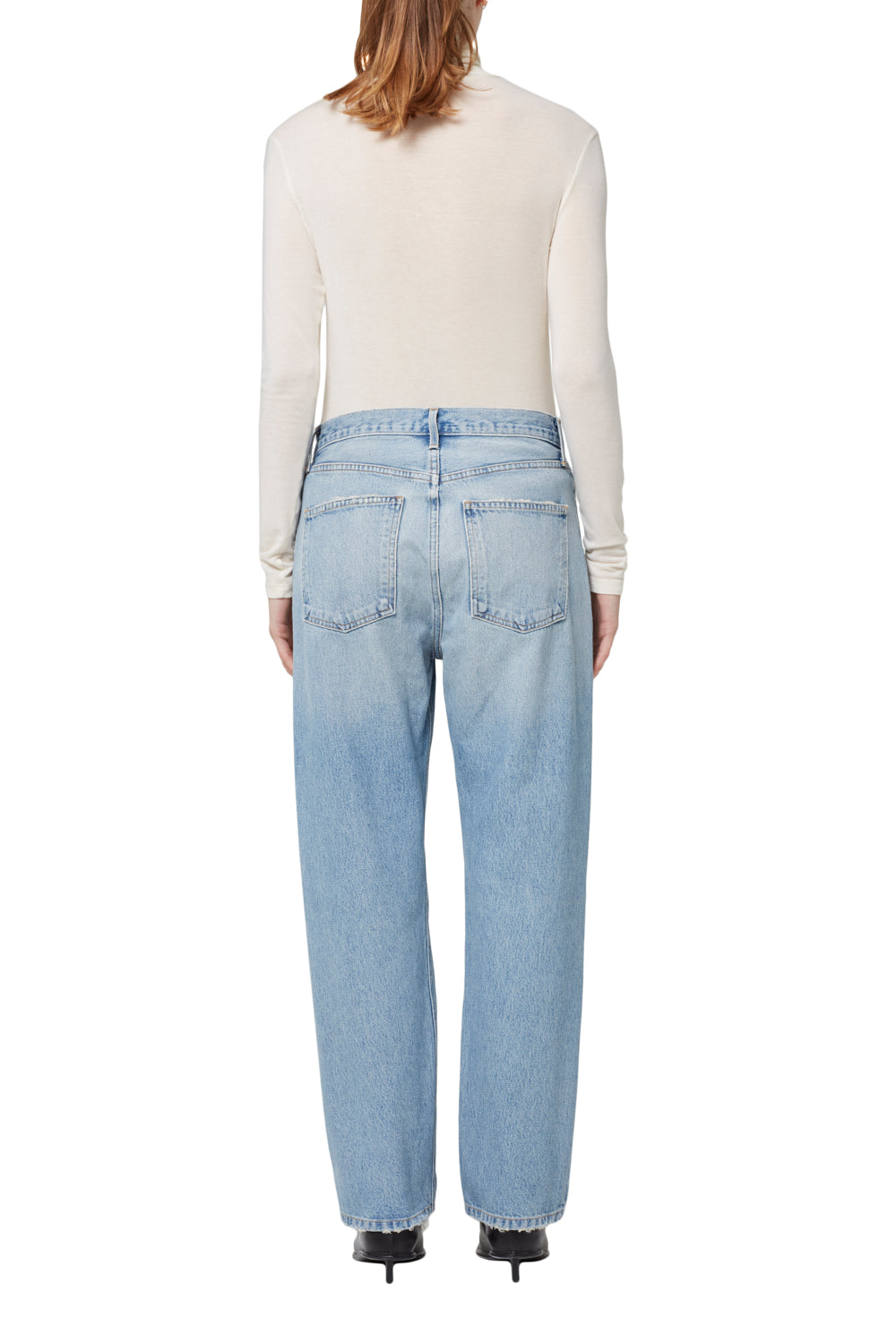 Back view of Agolde 90's Jean in a destructed light indigo wash.