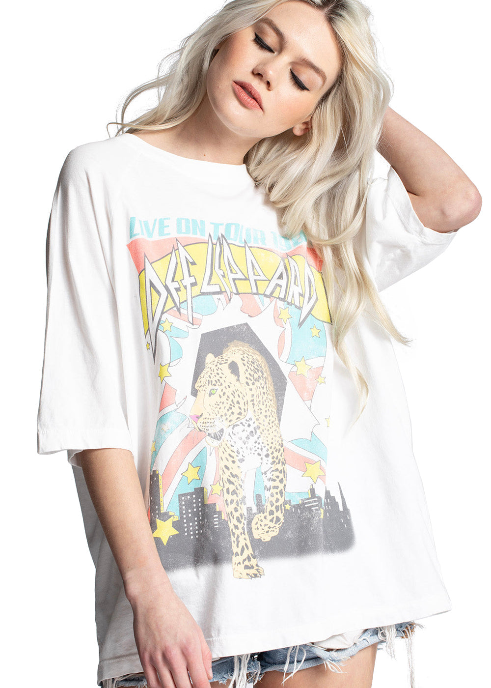 A close-up shot of the vintage-inspired Def Leppard t-shirt, highlighting the distressed "Hysteria" album logo and the "Live On Tour" text.

